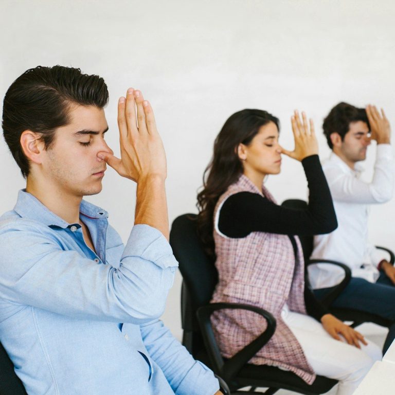 People practising breathwork in workplace